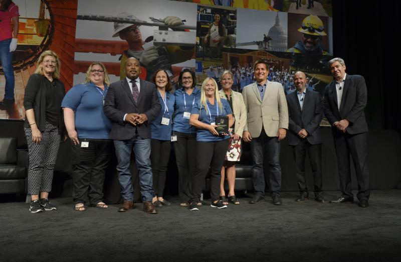 Celebrating the innovation award are (l-r) Susan Landahl of Exelon Generation; Kristi White, Shark Tank’s Daymond John; Lisa Clark, Juneann Baker and Tracy Orledgeof Pepco Holdings; Julie Nelson of The Precisionists; Brian Hoff of Exelon; Jorge Acevedo of Constellation; and Carim Khouzami of Exelon Utilities.